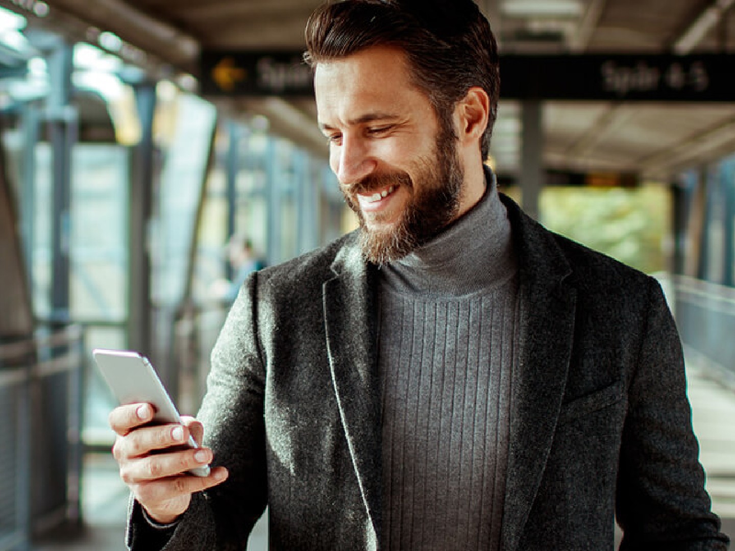 Man looking down at phone.